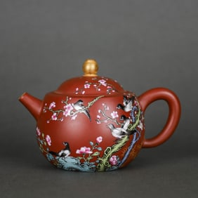 A RED-GROUND FAMILLE ROSE 'MAGPIE ON PLUM' TEAPOT