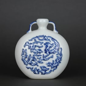 A WHITE-GLAZED BLUE AND WHITE CARVED 'DRAGON' MOONFLASK
