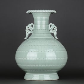 A CELADON CARVED 'LOTUS PETALS' DOUBLE-HANDLED VASE