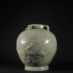 A PALE CELADON GLAZED 'DRAGON' JAR