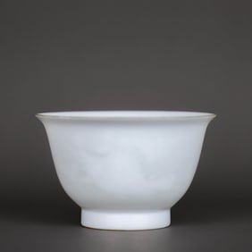 A WHITE-GLAZED INTERIOR CARVED 'FISH AND ALGAE' CUP