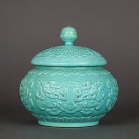 A TURQUOISE-GREEN GLAZED CARVED 'BEAST MASK' CHESS POT