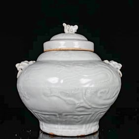 A SWEET WHITE-GLAZED 'DRAGON' COVERED JAR