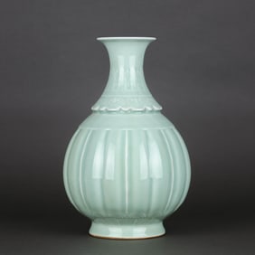 A PALE CELADON GLAZED CARVED 'PLANTAIN AND RUYI' YUHUCHUNPING