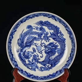 A  BLUE AND WHITE 'DRAGON AND PHOENIX' DISH
