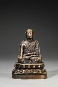 A TIBETAN ALLOY COPPER MASTER INLAID WITH SILVER