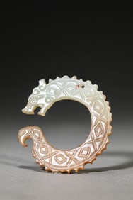 A JADE DRAGON-FORM PENDANT