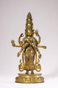 A GILT-BRONZE ELEVEN-FACED AVALOKITESHVARA