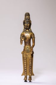 A GILT-BRONZE STANDING GUANYIN