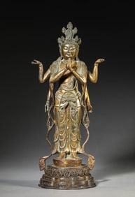 A GILT-BRONZE FOUR-ARMED AVALOKITESHVARA