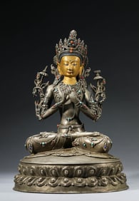A TIBETAN SILVER MANJUSHRI