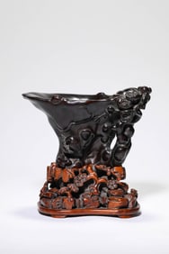 A WOOD CARVED 'BIRDS AND FLOWERS' RHINOCEROS HORN CUP