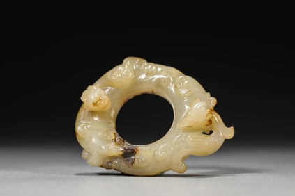 A JADE CARVED 'DRAGON AND PHOENIX' PENDANT