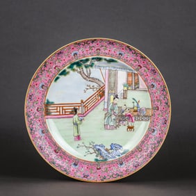 A RUBY-RED GROUND FAMILLE ROSE MEDALLION ‘FIGURE' DISH