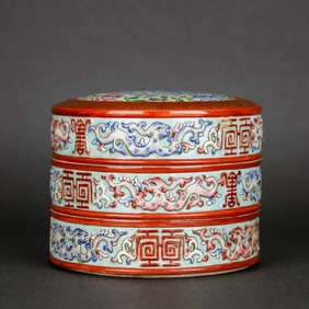 A GREEN-GROUND FAMILLE ROSE CARVED 'KUI DRAGON AND SHOU' BOX
