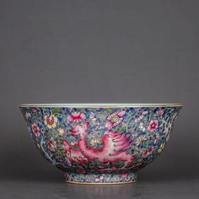 A BLUE-GROUND FAMILLE ROSE 'PHOENIX AMONG FLOWERS' BOWL