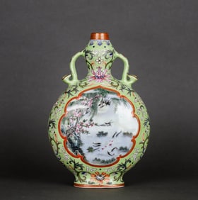 A GREEN-GROUND FAMILLE ROSE MEDALLION 'FLOWERS AND BIRDS' RUYI-HANDLED MOONFLASK