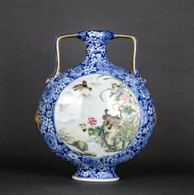 A BLUE AND WHITE RESERVED MEDALLION FAMILLE ROSE 'FLOWERS AND BIRDS' RUYI-HANDLED MOONFLASK