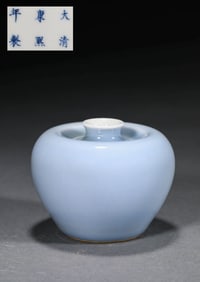 AN BLUE-GLAZED APPLE-SHAPED JAR