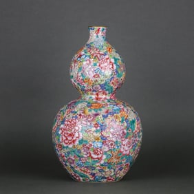 A FAMILLE ROSE 'MILLEFLEURS' GOURD-SHAPED VASE