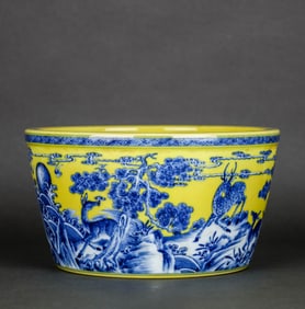 A YELLOW-GLAZED BLUE AND WHITE 'CRANE, DEER AND SPRING' WASHER