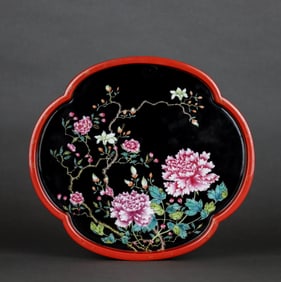A BLACK GLAZED ENAMEL 'PEONY AND FLOWERS' DISH