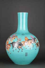 A TURQUOISE-GREEN GROUND FAMILLE ROSE ‘FIGURE' GLOBULAR VASE