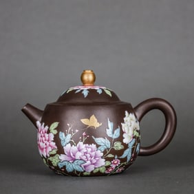 AN ENAMEL 'PEONY AND BUTTERFLIES' TEAPOT