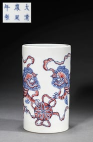 A BLUE AND WHITE WITH UNDERGLAZED RED 'AUSPICIOUS BEASTS' BRUSH POT