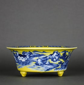 A YELLOW-GLAZED BLUE AND WHITE 'LANDSCAPE AND FIGURES' WASHER