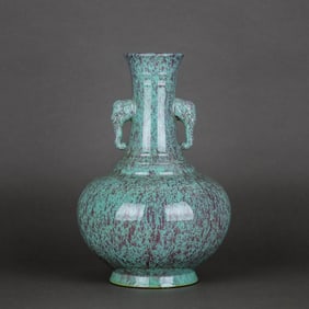 A FLAMBE-GLAZED ELEPHANT-HANDLED VASE