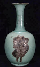 A CELADON 'FLOWERS'  VASE