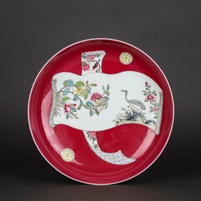 A RUBY-RED GROUND FAMILLE ROSE MEDALLION 'FLOWERS AND BIRDS' DISH