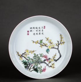 AN EXTERIOR RUBY RED-GLAZED, INTERIOR FAMILLE ROSE 'PLUM BLOSSOMS AND POETRY' DISH