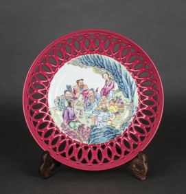 A FAMILLE ROSE RUBY-RED GLAZED 'EIGHT IMMORTALS' DISH