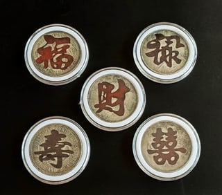 A SET OF FIVE SILVER COINS