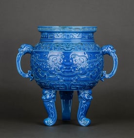 A BLUE GLAZED CARVED TRIPOD CENSER