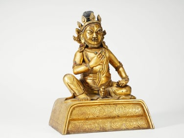 A GILT COPPER 'WEALTH GOD' FIGURE