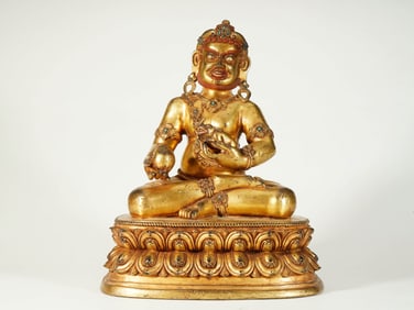 A GILT COPPER 'YELLOW JAMBALA' FIGURE