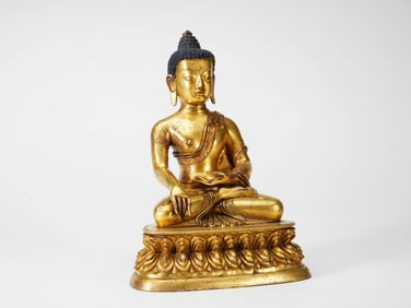 A GILT COPPER 'SAKYAMUNI' FIGURE