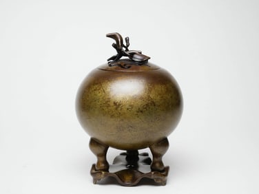 A COPPER INCENSE BURNER