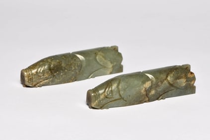 A PAIR OF JADE 'PIG' GRIPPERS