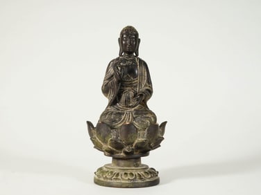 A COPPER 'SAKYAMUNI' FIGURE