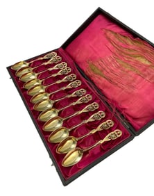 A SET OF SILVER GILT OPENWORK RELIEF COFFEE SPOON