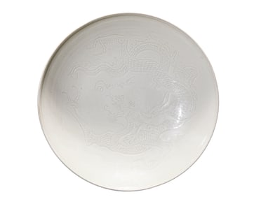 A DING-TYPE CARVED 'DRAGON' DISH