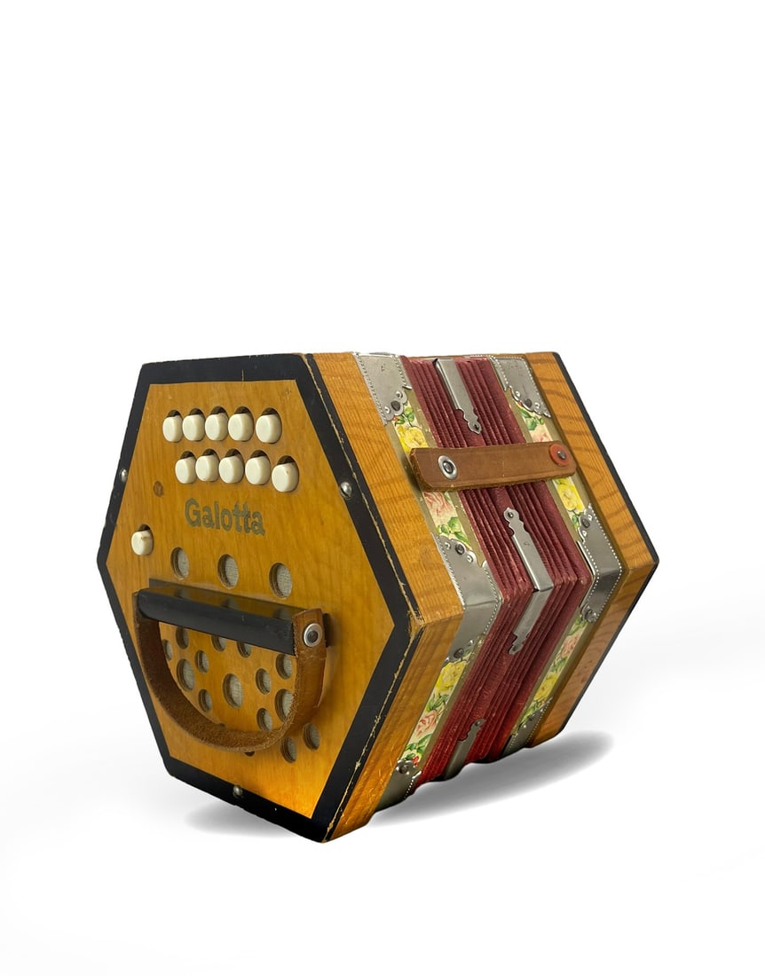 A WOOD 20-KEY ACCORDION: A WOOD 20-KEY ACCORDION Dimensions: Width 20.0 cm (7.87 in) x Length 15.0 cm (5.91 in). All measurements are approximate. Description: It has a cowhide handle. The bellows are in good condition, and i