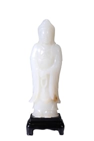 A WHITE JADE FIGURE OF GUANYIN