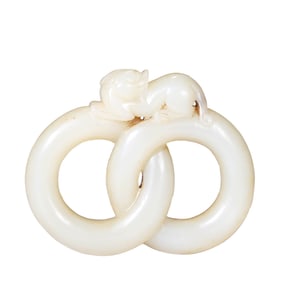 A WHITE JADE 'DOUBLE RINGS' ORNAMENT