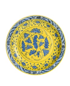A YELLOW-GROUND BLUE AND WHITE 'INTERLOCKING GRAPES' DISH