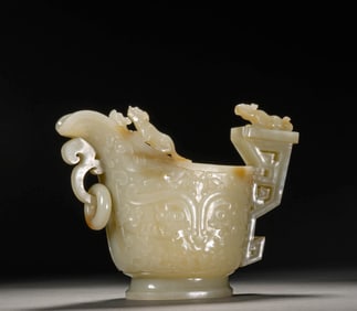 A WHITE JADE 'ANIMAL-MASK' CUP